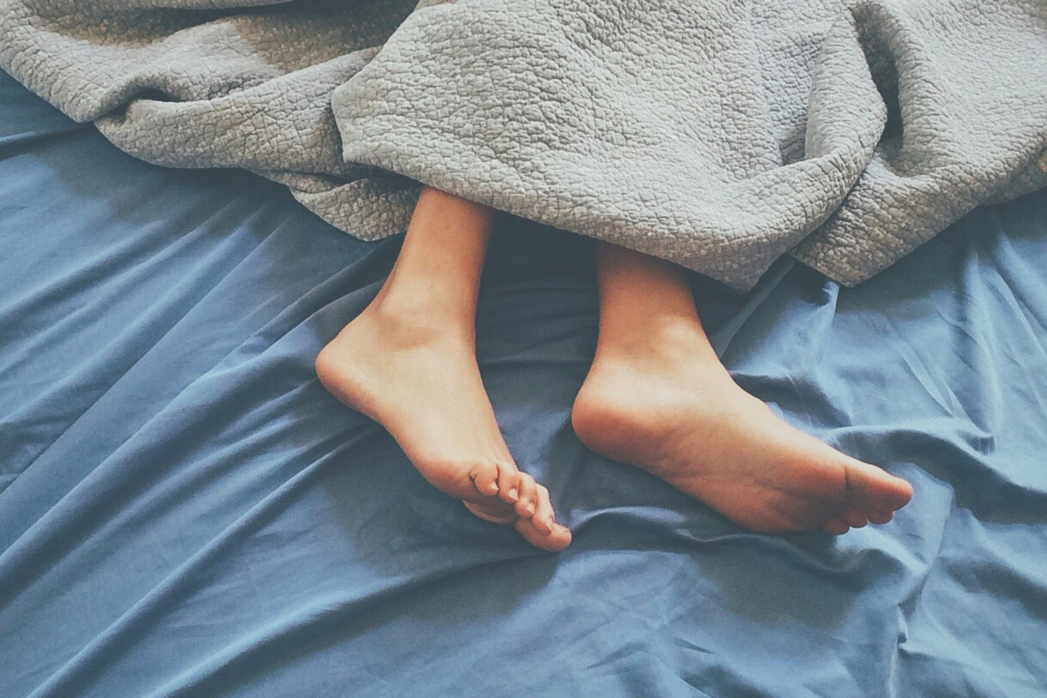 De voeten van Guido in bed